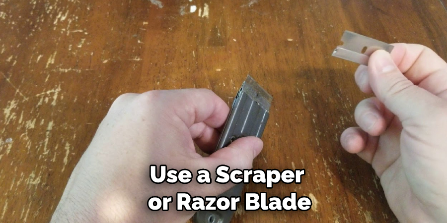 Use a Scraper or Razor Blade