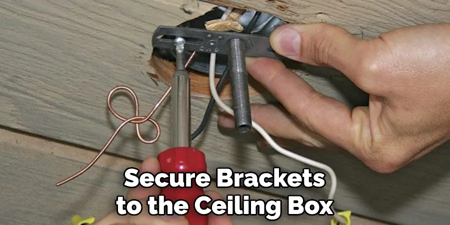 Secure Brackets to the Ceiling Box