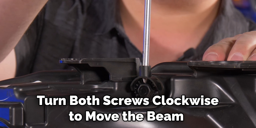 Turn Both Screws Clockwise to Move the Beam
