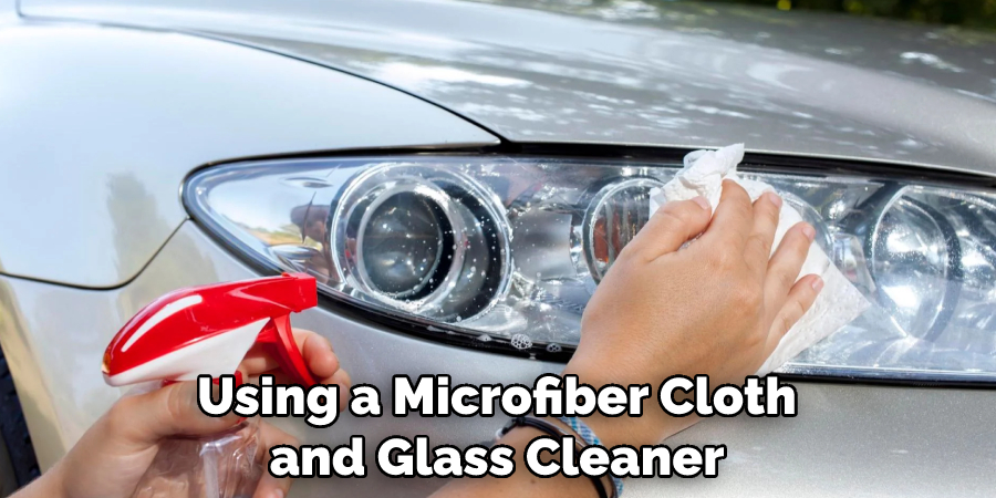 Using a Microfiber Cloth and Glass Cleaner