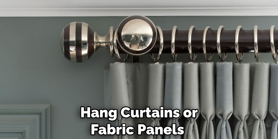Hang Curtains or Fabric Panels 
