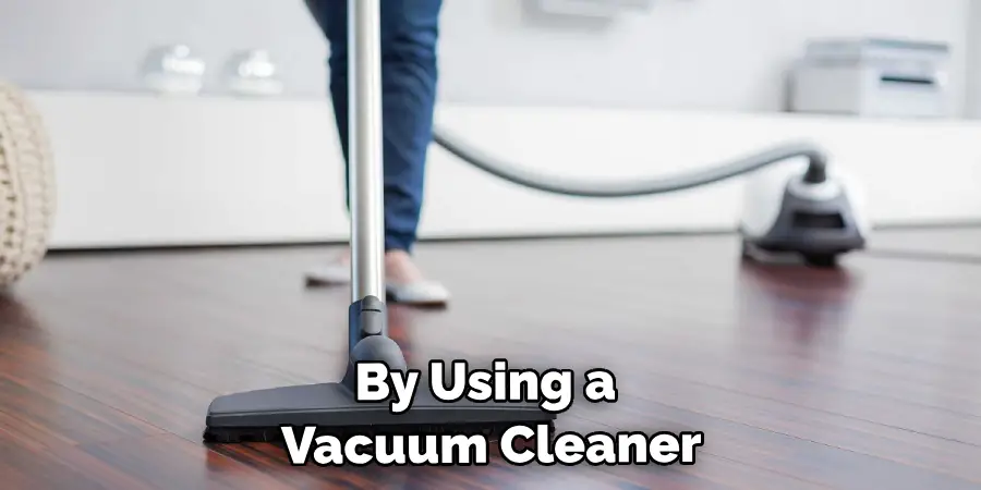 By Using a Vacuum Cleaner