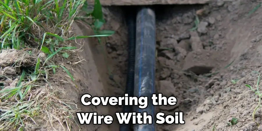 Covering the Wire With Soil