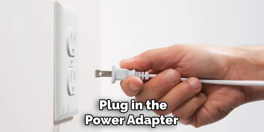  Plug in the Power Adapter