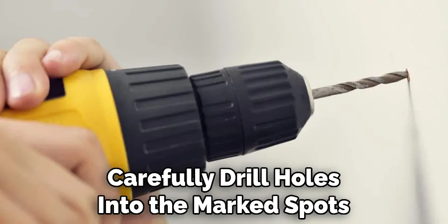 Carefully Drill Holes Into the Marked Spots