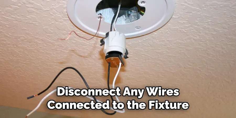 Disconnect Any Wires Connected to the Fixture