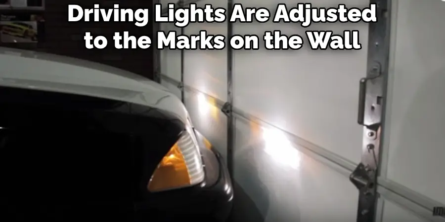 Driving Lights Are Adjusted to the Marks on the Wall