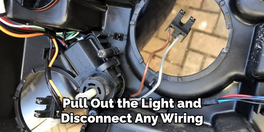 Pull Out the Light and Disconnect Any Wiring