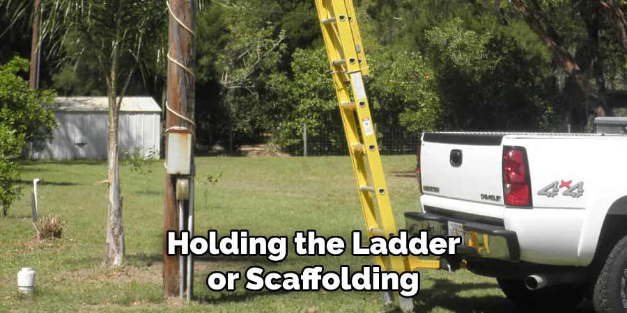 Holding the Ladder or Scaffolding