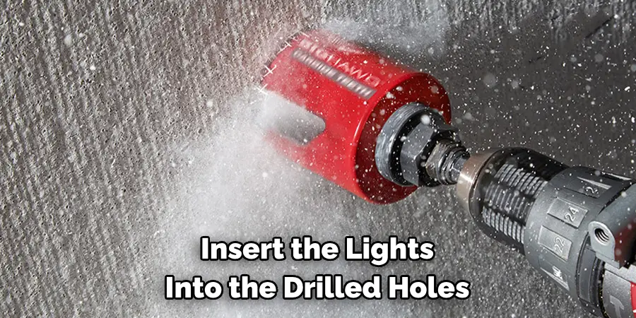 Insert the Lights Into the Drilled Holes