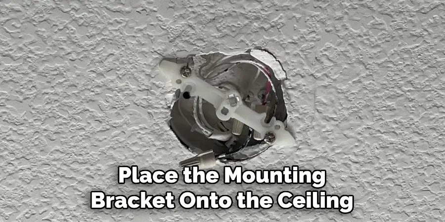 Place the Mounting Bracket Onto the Ceiling