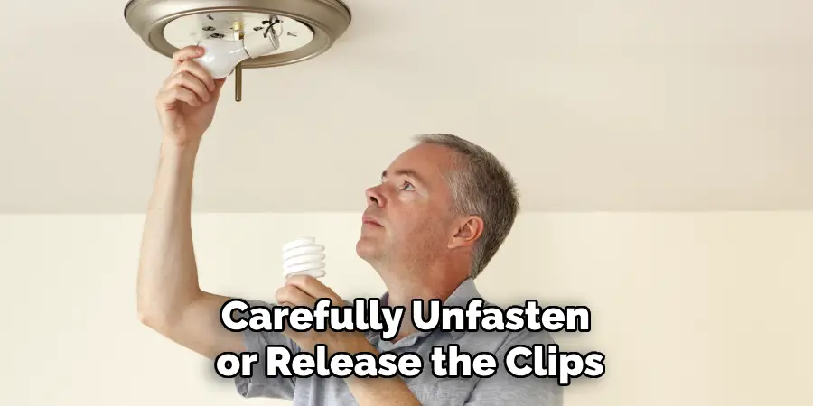 Carefully Unfasten or Release the Clips