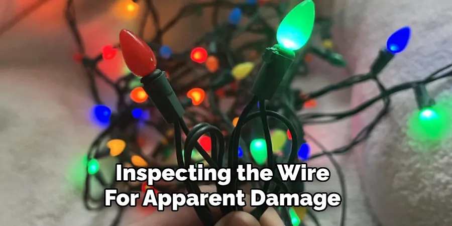 inspecting the wire for apparent damage