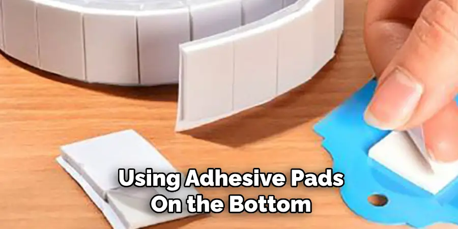 Using Adhesive Pads
On the Bottom
