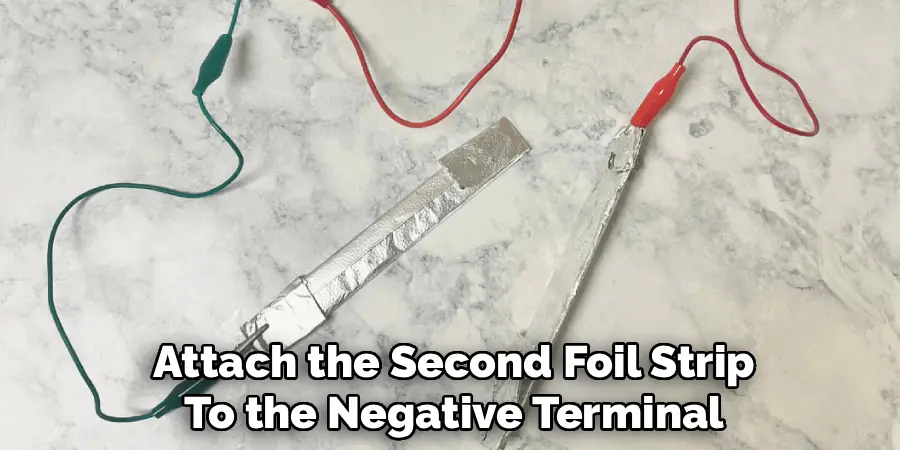 Attach the Second Foil Strip
To the Negative Terminal