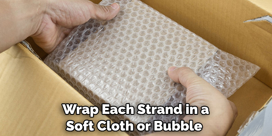 Wrap Each Strand in a Soft Cloth or Bubble 