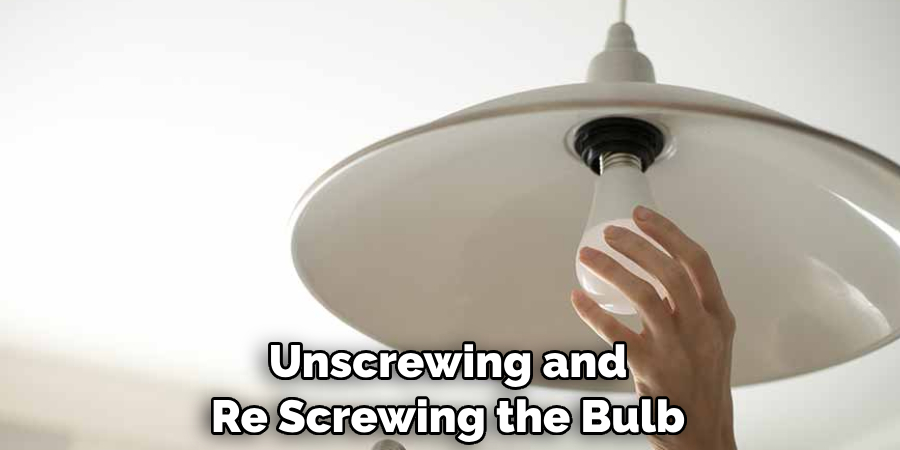 Unscrewing and Re Screwing the Bulb