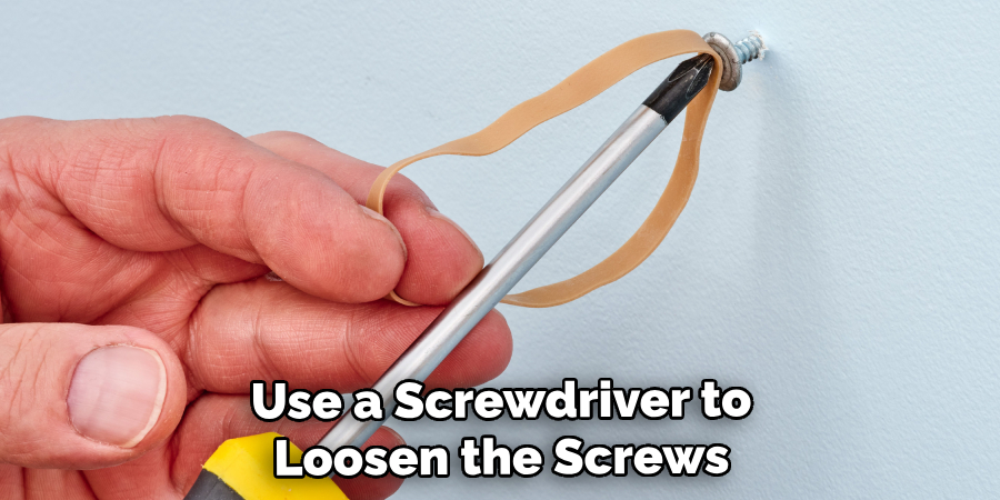 Use a Screwdriver to Loosen the Screws