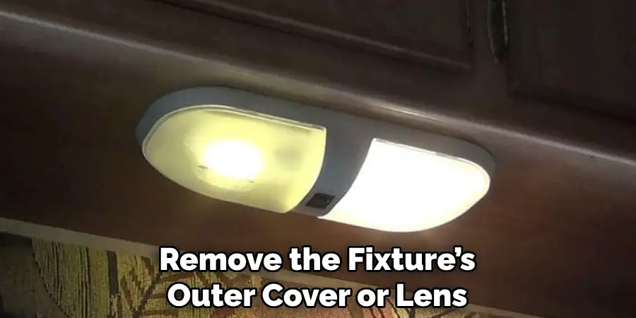 Remove the Fixture’s
Outer Cover or Lens